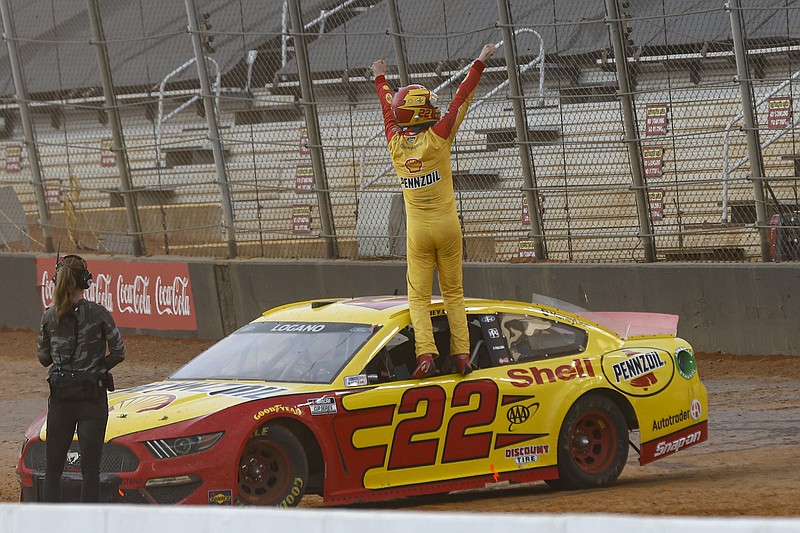 Joey Logano celebrates after winning a NASCAR Cup Series auto race, Monday, March 29, 2021, in Bristol, Tenn. (AP Photo/Wade Payne)