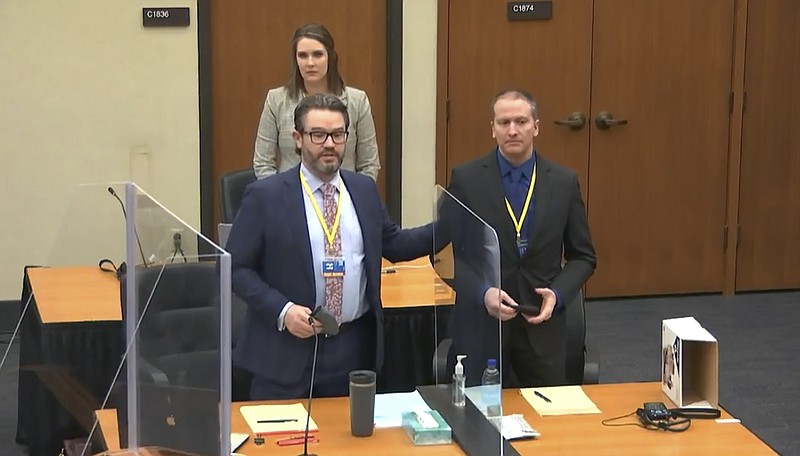 FILE - In this image taken from video, defense attorney Eric Nelson, left, defendant and former Minneapolis police officer Derek Chauvin, right, and Nelson's assistant Amy Voss, back, introduce themselves to potential jurors on Tuesday, March 23, 2021, as Hennepin County Judge Peter Cahill presides over jury selection in the trial of Chauvin at the Hennepin County Courthouse in Minneapolis. Chauvin is charged in the May 25, 2020 death of George Floyd. The huge task for jurors at the trial of Chauvin showed during jury selection as some would-be jurors said they were unnerved by the very thought of being on the panel. (Court TV, via AP, Pool)

