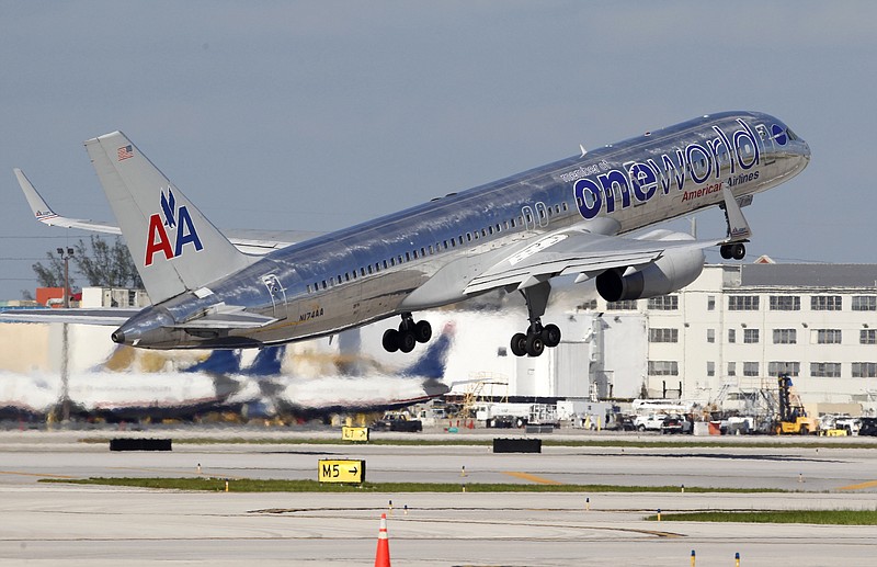 AP Photo/Wilfredo Lee / American Airlines Boeing 757 passenger jet takes off from Miami International Airport in Miami.