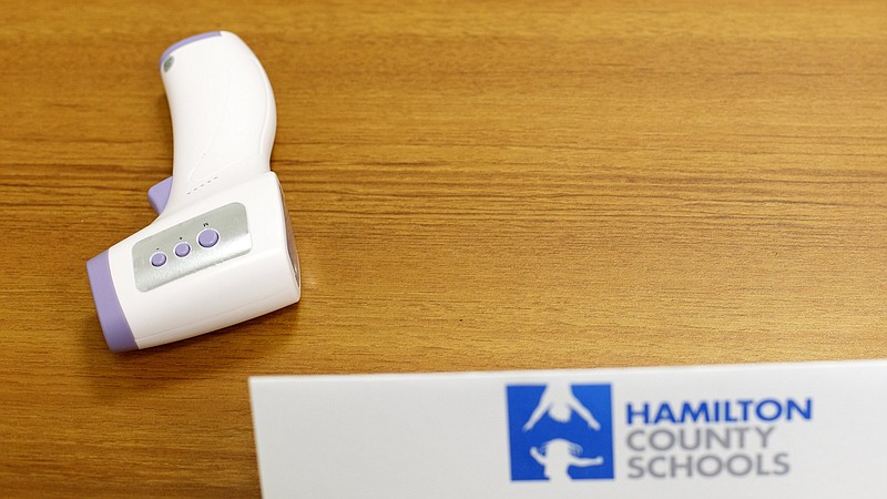 Staff photo by C.B. Schmelter / A thermometer is seen on a table in the Hamilton County Schools board room on Tuesday, May 12, 2020 in Chattanooga, Tenn. The district developed the summer learning plan last year due to school closures amid the coronavirus pandemic.