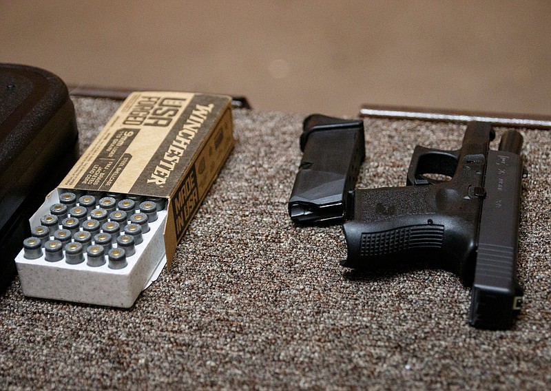 Staff photo by Doug Strickland / A handgun is unloaded at the shooting range during a concealed carry permit class at Shooter's Supply on Saturday, May 11, 2019, in Chattanooga, Tenn. On Monday, a bill allowing Tennesseans to publicly carry a handgun without a state-issued license and with no required firearms training or criminal background checks won final approval in the House.