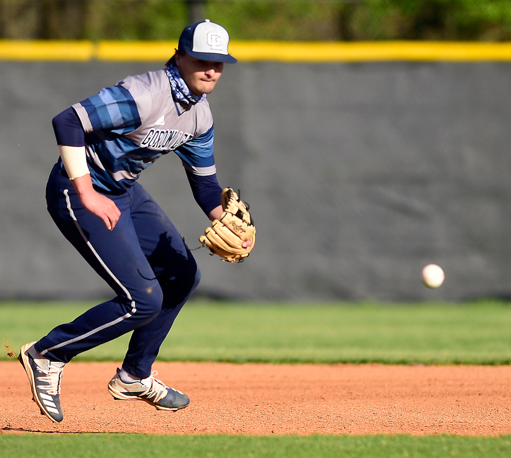 Staff Photo by Robin Rudd / Gordon Lee third baseman Brody Cobb (4) fields a ground ball. The Gordon Lee Trojans faced the South Pittsburg Pirates in the Lookout Valley Classic, at Lookout Valley High School, on April 1, 2021.