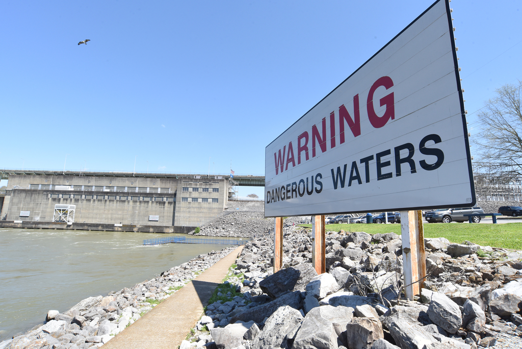 Staff Photo by Matt Hamilton / A sign warns of the normally-dangerous waters at the Chickamauga Dam on Thursday, April 1, 2021.