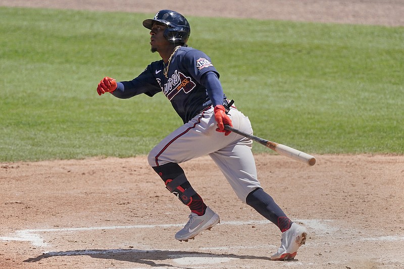 Atlanta Braves second baseman Ozzie Albies (1) runs to first base after hitting a three-run home run in the fifth inning of a spring training baseball game against the Boston Red Sox Tuesday, March 30, 2021, in Fort Myers, Fla. (AP Photo/John Bazemore)