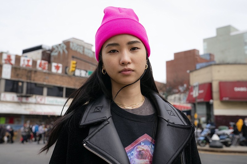 Teresa Ting stands for a portrait, Wednesday, March 31, 2021, in the Flushing neighborhood of the Queens borough of New York. The vicious assault of a 65-year-old woman while walking to church this week near New York City's Times Square has heightened already palpable levels of outrage over anti-Asian attacks that started with the pandemic. Ting, a 29-year-old Chinese American, started what has become the Main Street Patrol following an attack on another older Asian American woman in February. "It literally could have been my mother had it been the wrong place, wrong time," Ting said of that attack. (AP Photo/John Minchillo)