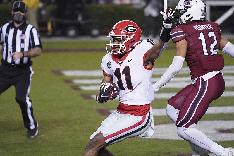 AP file photo by Sean Rayford / Arian Smith (11) became the latest Georgia wide receiver injured this spring, but coach Kirby Smart was not overly concerned after the sophomore sprained his wrist during the Bulldogs' scrimmage Saturday.