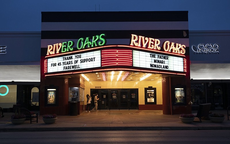 People buying tickets to see films at River Oaks Theatre on the second last day of the theater Wednesday, March 24, 2021, in Houston. The historic theater that director Richard Linklater called his "film school" and that for decades was the place to catch hard-to-find independent and foreign films has closed for good. Like many U.S. movie theaters and other businesses, the River Oaks Theatre was a victim of the coronavirus pandemic. (Yi-Chin Lee/Houston Chronicle via AP)


