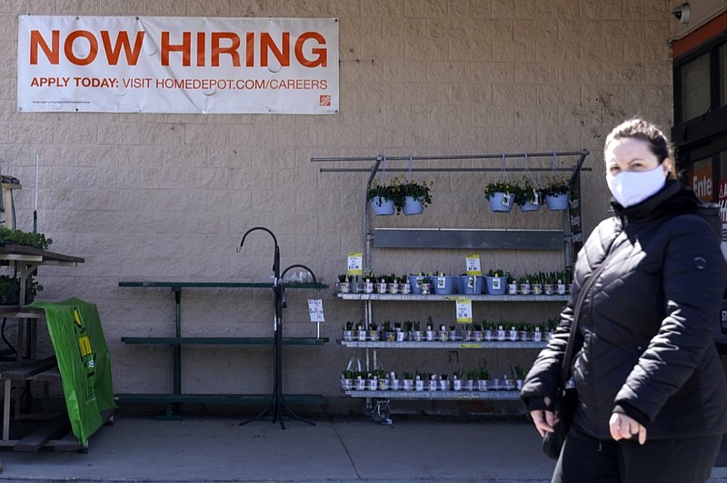 A hiring sign is seen outside home improvement store in Mount Prospect, Ill., Friday, April 2, 2021. (AP Photo/Nam Y. Huh)


