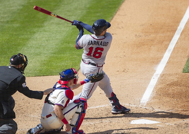 AP photo by Laurence Kesterson / Travis d'Arnaud follows through on his home run in the seventh inning of the Atlanta Braves' game against the host Philadelphia Phillies on Sunday afternoon. Atlanta lost 2-1 as the Phillies were dominant on the mound again to complete a sweep of the three-game series to open the season.