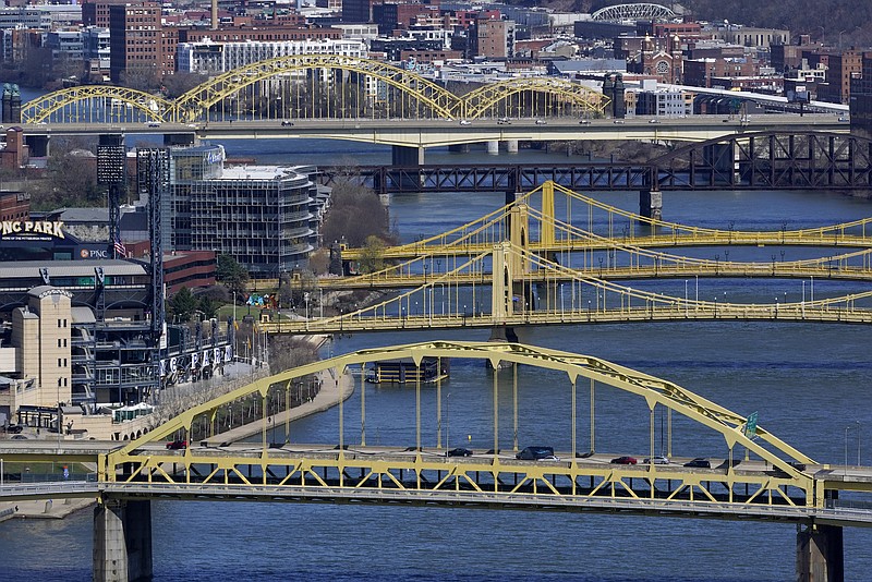 Photo by Gene J. Puskar of The Associated Press / This April 2, 2021, file photo shows bridges spanning the Allegheny River in downtown Pittsburgh.