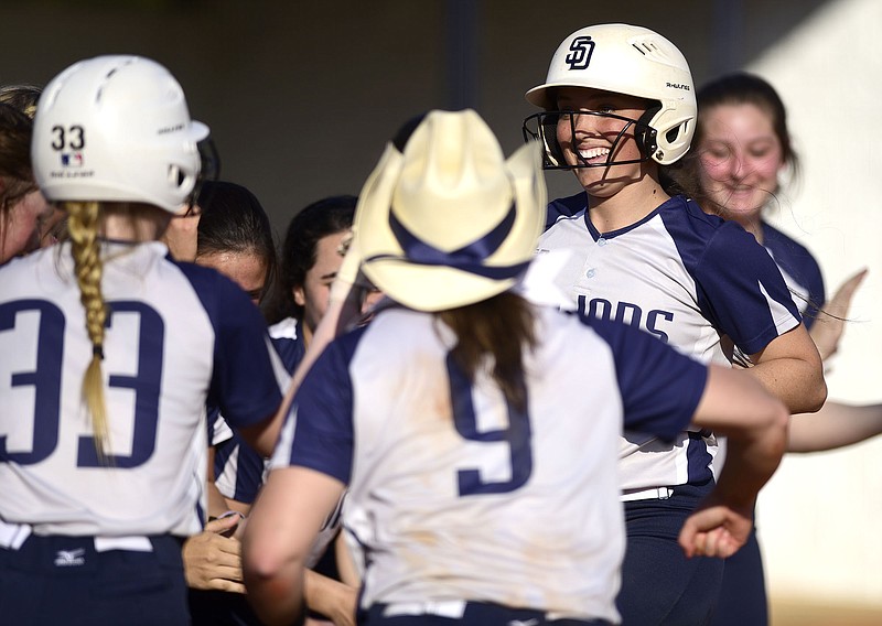 Staff Photo by Robin Rudd /  Soddy-Daisy's Courtney Sneed (22) smiles as approaches home plater after hitting a home run.  Sneed's blast proved to be the winning run as the Lady Trojans beat Walker Valley 6 to 1.  The Soddy-Daisy Lady Trojans visited the Walker Valley Lady Mustangs in TSSAA softball on April 5, 2021.