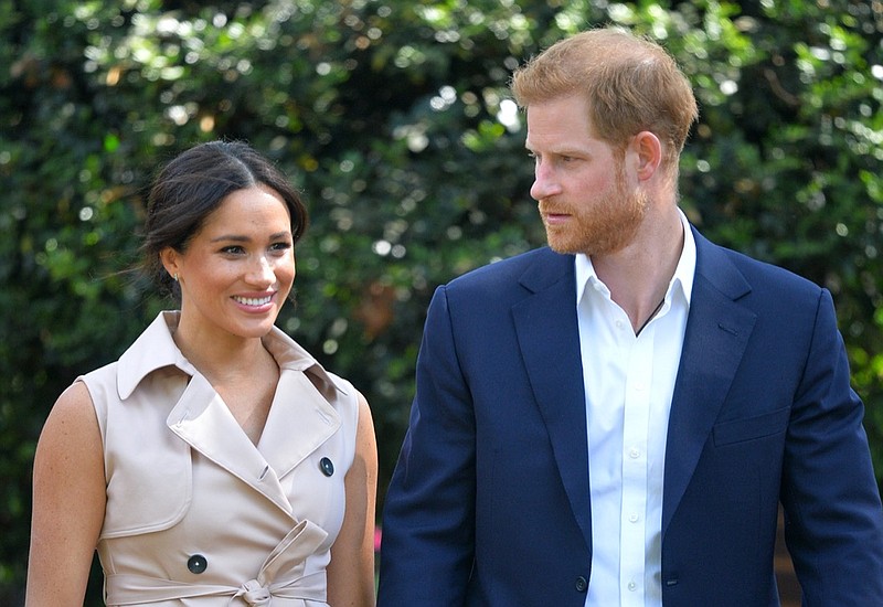 FILE - In this Oct. 2, 2019, file photo, Britain's Prince Harry and Meghan Markle appear at the Creative Industries and Business Reception at the British High Commissioner's residence in Johannesburg. Their first Netflix series will center on the Invictus Games, which gives sick and injured military personnel and veterans the opportunity to compete in sports. The Duke and Duchess of Sussex's Archewell Productions announced Tuesday its first series to hit the streaming service. (Dominic Lipinski/Pool via AP, File)