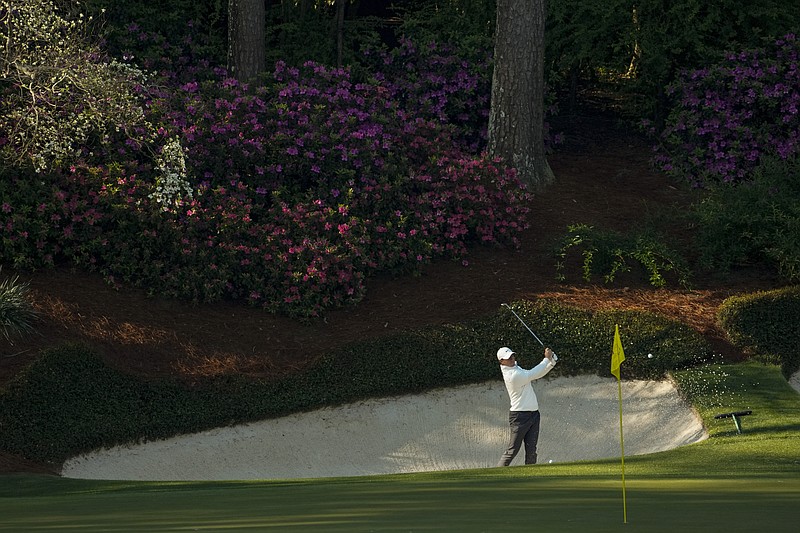 Rory McIlroy, of Northern Ireland, hits from the bunker on the 13th hole during a practice round for the Masters golf tournament on Tuesday, April 6, 2021, in Augusta, Ga. (AP Photo/David J. Phillip)