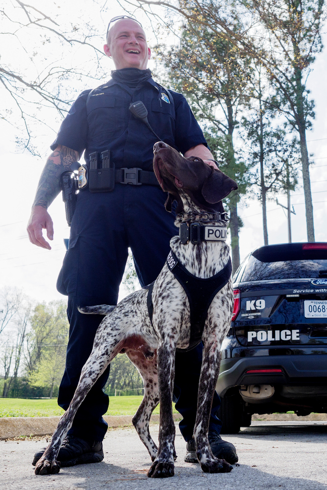 Staff photo by C.B. Schmelter / Chattanooga Police Department Sgt. Sean O'Brien stands with K9 Gunther before a press conference at the Tennessee Riverpark on Wednesday, April 7, 2021 in Chattanooga, Tenn.