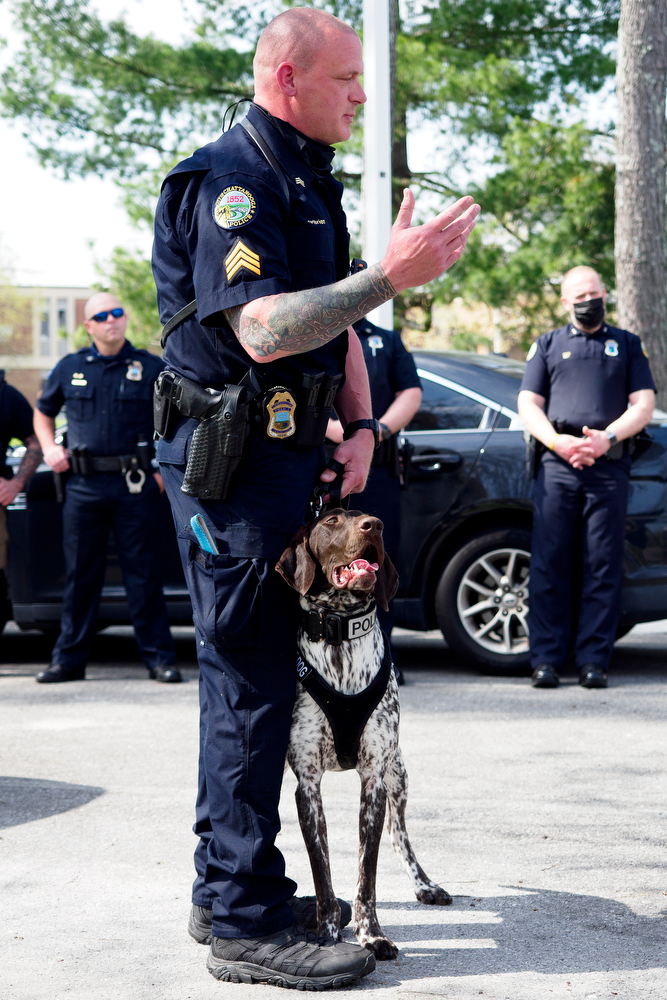 Staff photo by C.B. Schmelter / Chattanooga Police Department Sgt. Sean O'Brien stands with K9 Gunther as he speaks during a press conference at the Tennessee Riverpark on Wednesday, April 7, 2021 in Chattanooga, Tenn.