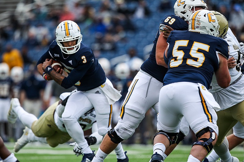 Staff file photo by Troy Stolt / UTC quarterbacks Drayton Arnold (3) and Cole Copeland, not pictured, each had a chance at the controls of the offense during the Mocs' spring schedule, but neither established himself as a clear better option over the other.