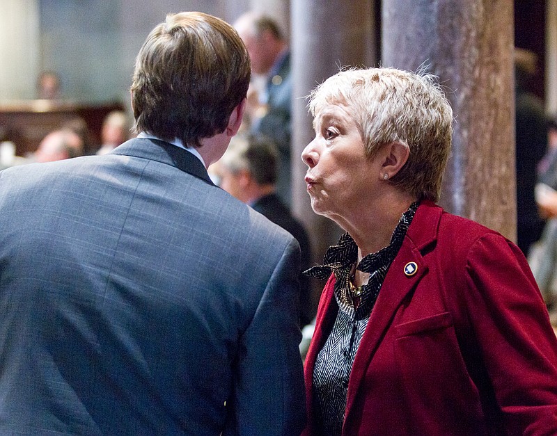 State Sen. Janice Bowling, R-Tullahoma, consults with Sen. Brian Kelsey, R-Germantown, during a Senate floor session Nashville, Tenn. on Thursday, March 6, 2014. The chamber later passed Kelsey's bill to require Republican Gov. Bill Haslam to seek legislative approval for any deal on Medicaid expansion in Tennessee. (AP Photo/Erik Schelzig)