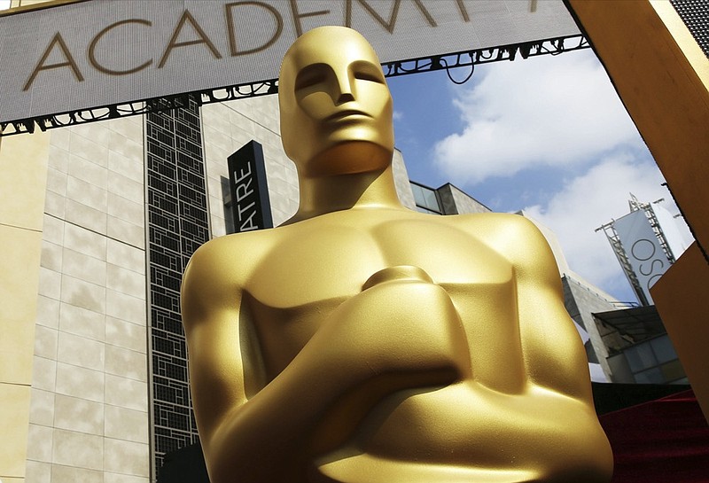 FILE - In this Feb. 21, 2015 file photo, an Oscar statue appears outside the Dolby Theatre for the 87th Academy Awards in Los Angeles. (Photo by Matt Sayles/Invision/AP, File)


