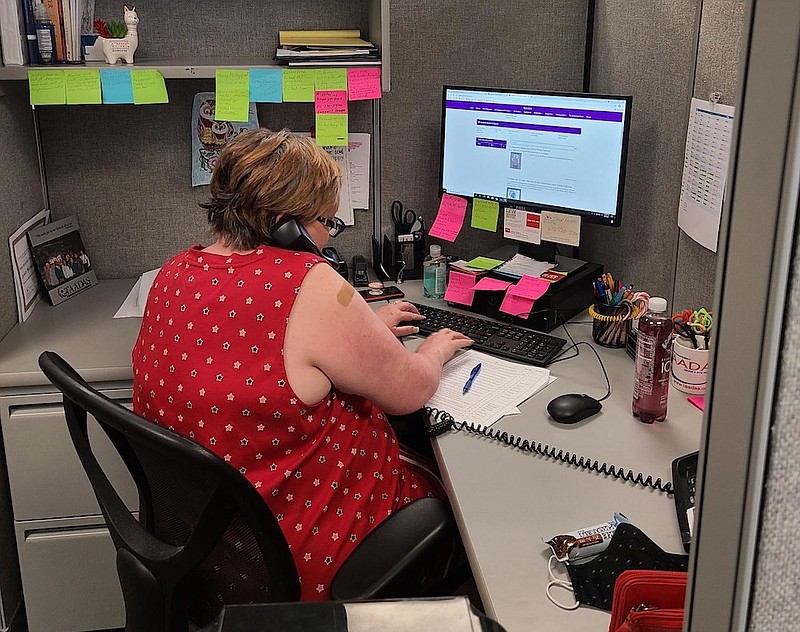 Photo courtesy of TAADAS / Michelle Yarbrough answers a REDLINE/Warmline call on Wednesday, April 7, 2021. The emotional support line is a talk line where call-takers help essential workers navigate stress related to the pandemic.