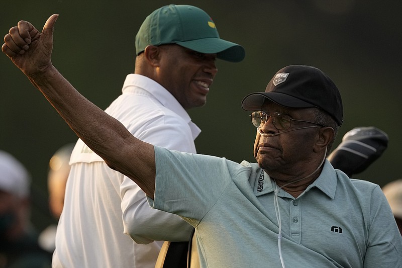 AP photo by Charlie Riedel / Lee Elder gestures as he arrives for the ceremonial tee shots before the first round of the Masters on Thursday in Augusta, Ga. Elder, who in 1975 became the first Black golfer to compete in the Masters, joined six-time Masters champion Jack Nicklaus and three-time winner Gary Player as honorary starters for this year's tournament.