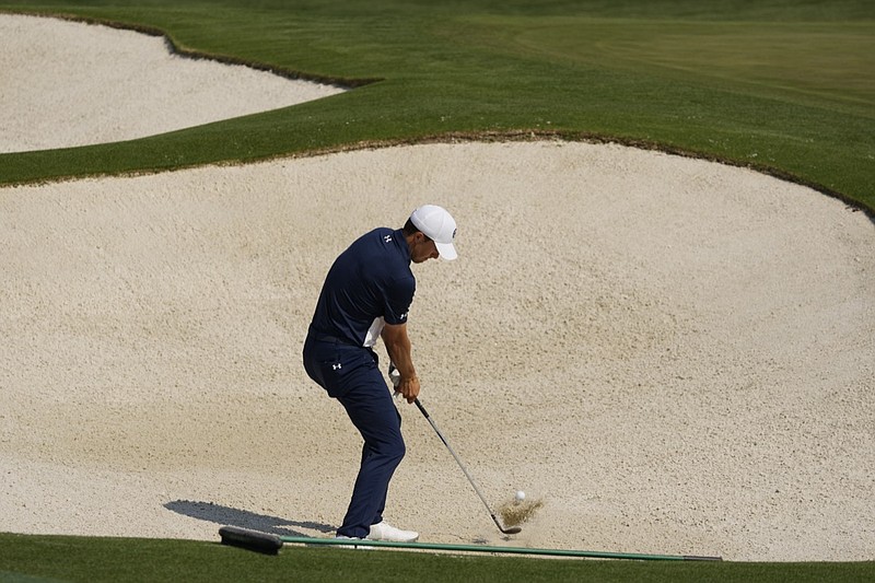Jordan Spieth hits out of a bunker on the driving range during a practice round for the Masters golf tournament on Wednesday, April 7, 2021, in Augusta, Ga. (AP Photo/Charlie Riedel)


