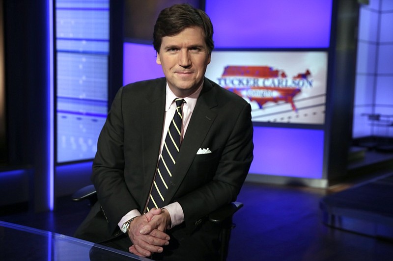 FILE - In this Thursday, March 2, 2107 file photo, Tucker Carlson, host of "Tucker Carlson Tonight," poses for a photo in a Fox News Channel studio in New York. (AP Photo/Richard Drew, File)


