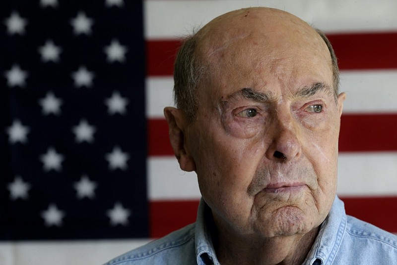 FILE -This April 17, 2014 file photo shows Ray Lambert, a combat veteran of the D-Day invasion, at his home in Seven Lakes, N.C. Ray Lambert, the Army medic who survived multiple wounds on D-Day and was saluted by a president on the World War II battle's 75th anniversary, died on Friday, April 9, 2021. He was 100. (AP Photo/Gerry Broome, File)


