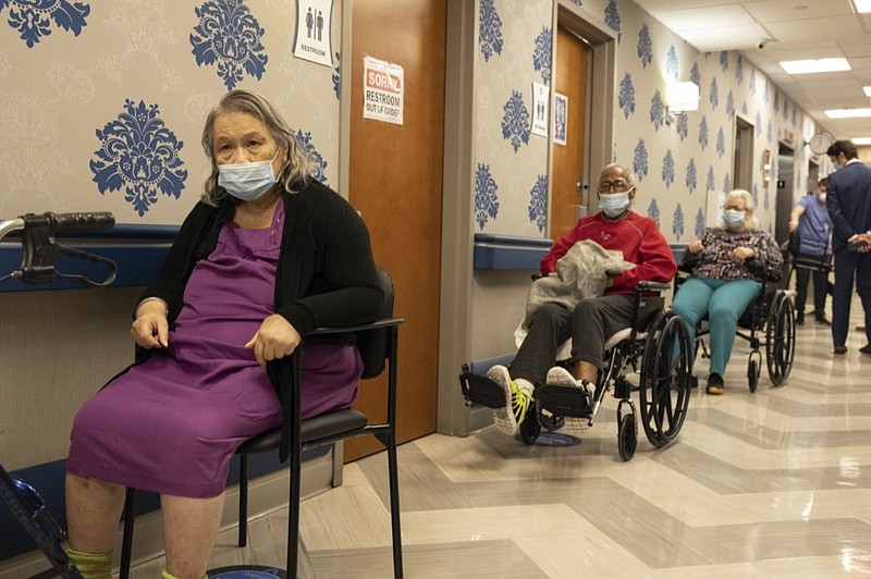 FILE - In this Friday, Jan. 15, 2021 file photo, nursing home residents wait on line to receive a COVID-19 vaccine at Harlem Center for Nursing and Rehabilitation, a nursing home facility in the Harlem neighborhood of New York. (AP Photo/Yuki Iwamura, File)


