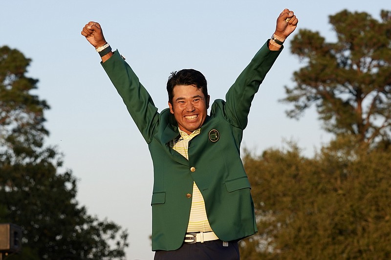 AP photo by Gregory Bull / Hideki Matsuyama celebrates after putting on the champion's green jacket after winning the Masters on Sunday in Augusta, Ga.