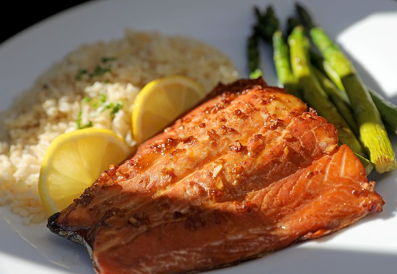 Asian Baked Salmon soaks in a marinade that gives the fish a rich mahogany color and a lovely crunch when baked. / Photo by Christian Gooden/St. Louis Post-Dispatch/TNS