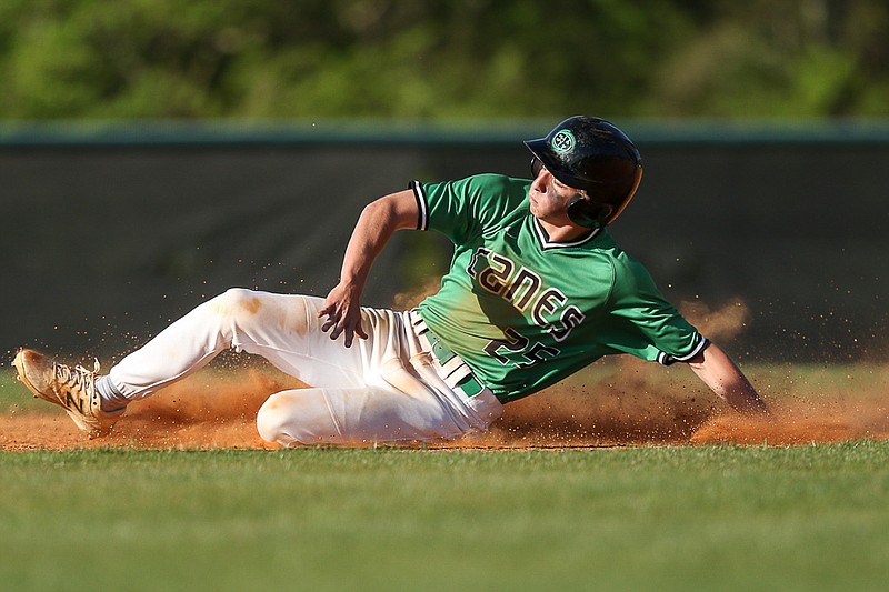 Staff photo by Troy Stolt / East Hamilton right fielder Joe Quinlan (25) slides into second base to steal during the baseball game between East Hamilton and Soddy Daisy high schools on Monday, April 12, 2021 in Ooltewah, Tenn.