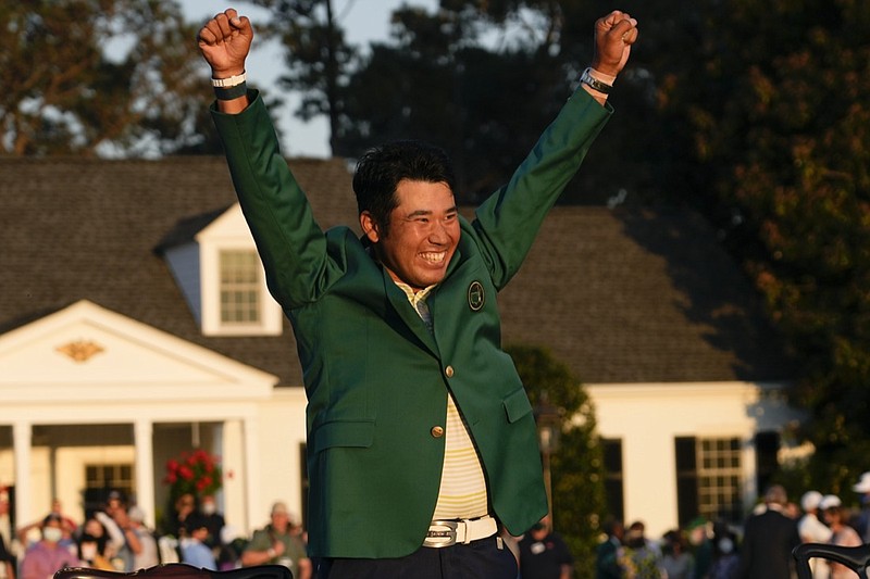 Hideki Matsuyama, of Japan, celebrates during champion's green jacket ceremony after winning the Masters golf tournament on Sunday, April 11, 2021, in Augusta, Ga. (AP Photo/David J. Phillip)