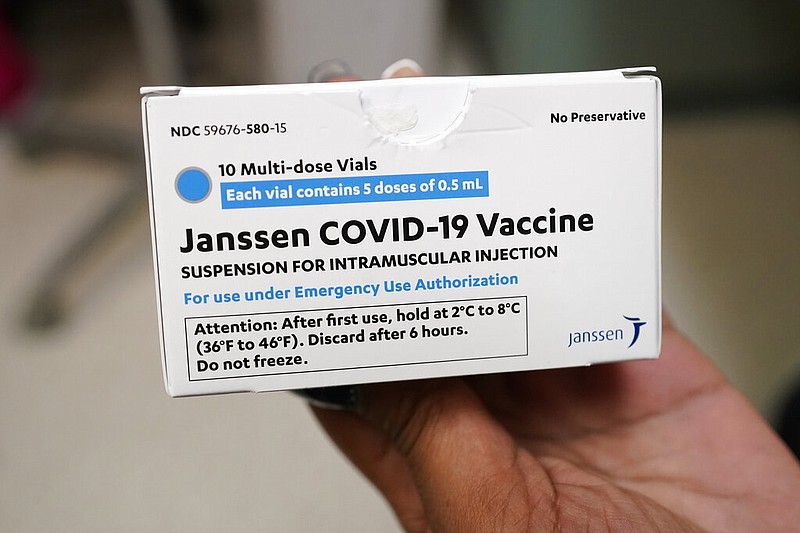 Sharis Carr, a nurse at the Aaron E. Henry Community Health Service Center in Clarksdale, Miss., holds a box containing doses of the Johnson & Johnson COVID-19 vaccine Wednesday, April 7, 2021. The U.S. is recommending a "pause" in using the single-dose Johnson & Johnson COVID-19 vaccine to investigate reports of potentially dangerous blood clots. (AP Photo/Rogelio V. Solis)