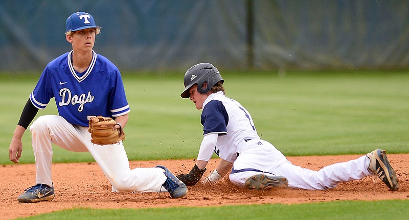 Staff Photo by Robin Rudd / Gordon Lee's Nate Dunfee (2) steals second while Trion's Brandon Dover (7) awaits the throw. The Trion Bulldogs visited the Gordon Lee Trojans in a GHSA high school baseball game on April 13, 2021.