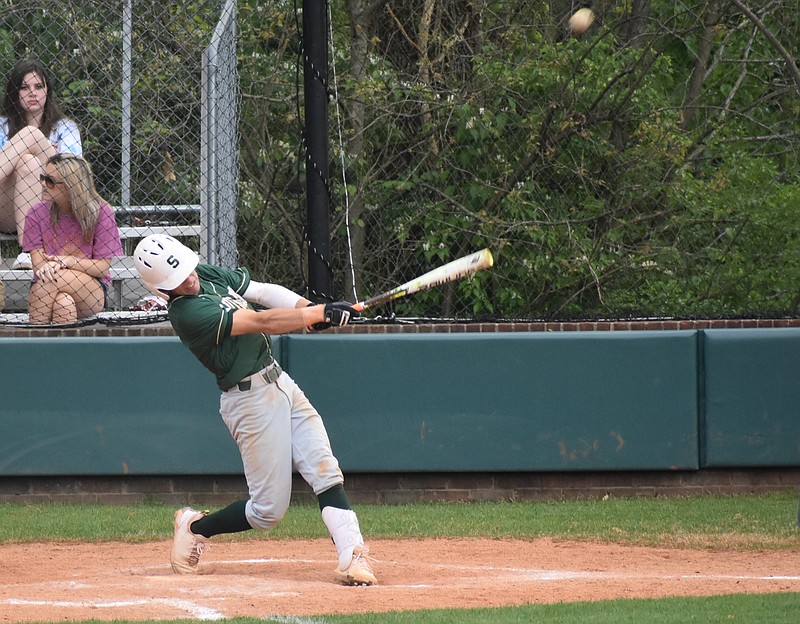 Staff photo by Patrick MacCoon / Silverdale Baptist leadoff hitter Turner Junkins launches a deep shot off the right field fence during Tuesday's district road victory over Notre Dame.