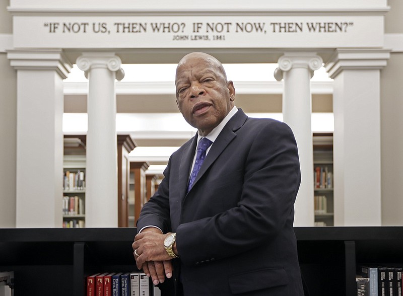 FILE - This Nov. 18, 2016 file photo shows Rep. John Lewis, D-Ga., in the Civil Rights Room in the Nashville Public Library in Nashville, Tenn. Some last thoughts from Lewis will be published this summer. Grand Central Publishing announced Tuesday that Lewis' "Carry On: Reflections for a New Generation" will come out July 13, almost a year after he died at age 80. (AP Photo/Mark Humphrey, File)