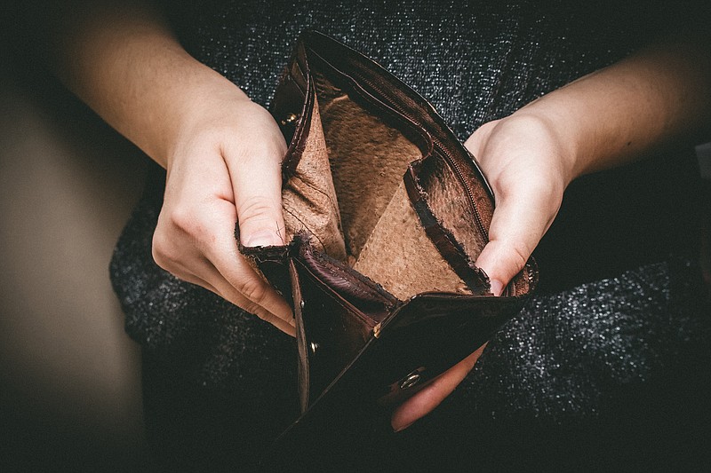 Getty Images / Empty wallet, money trouble tile