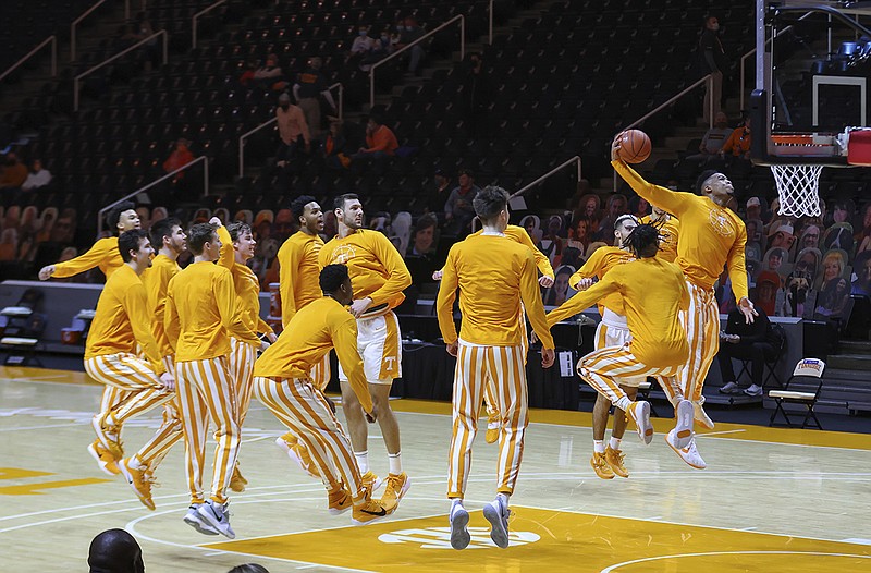 Pool photo by Randy Sartin via AP / Tennessee basketball players warm up before an SEC home game against Kentucky on Feb. 20.