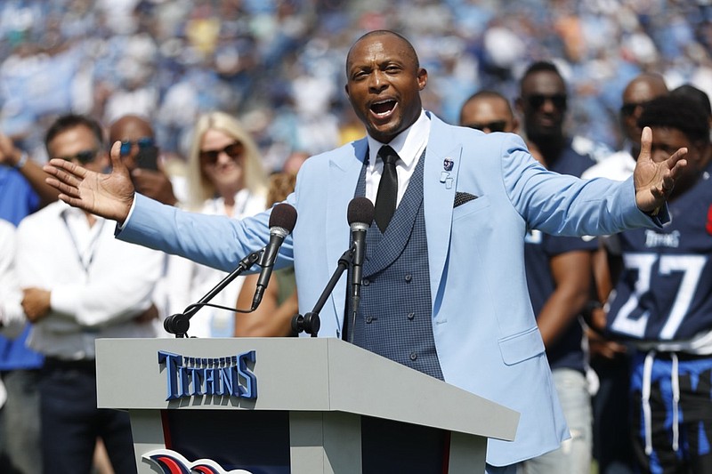 Eddie George of the Tennessee Titans carries the ball during the game