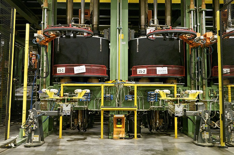 Staff photo by C.B. Schmelter / The curing presses are seen inside the tire manufacturing plant at Nokian Tyres in Dayton, Tenn.