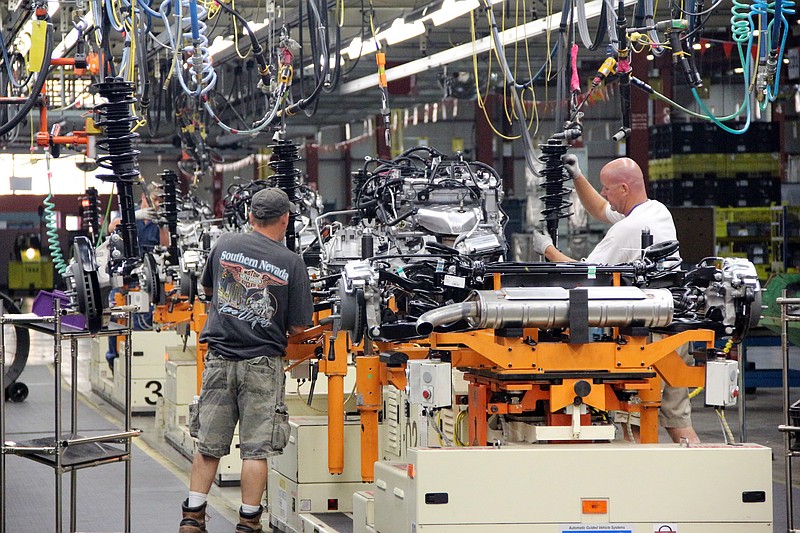 AP Photo/General Motors Vehicles are assembled at the General Motors manufacturing plant in Spring Hill, Tenn. A 2.8 million-square-foot plant will go up next to the auto plant to make batteries for EVs.