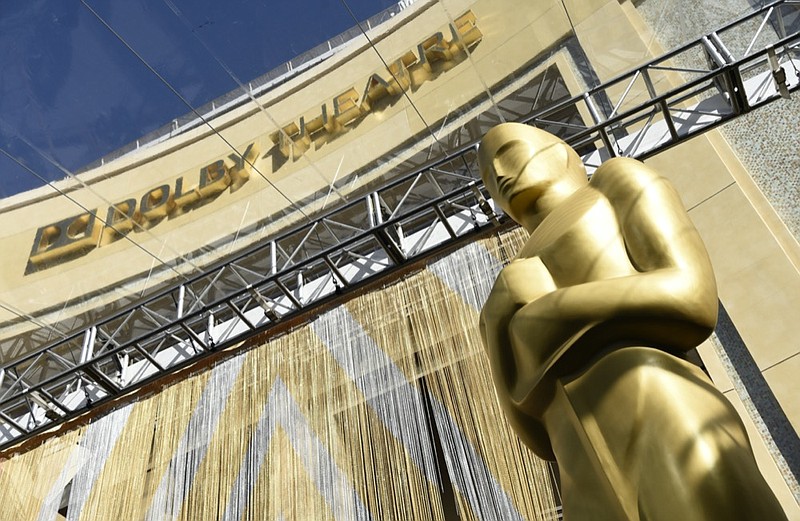 FILE - In this Feb. 24, 2016, file photo, an Oscar statue is pictured underneath the entrance to the Dolby Theatre in Los Angeles. (Photo by Chris Pizzello/Invision/AP, File)


