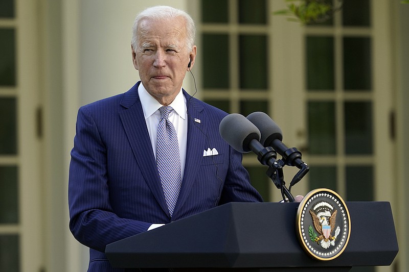 President Joe Biden listens as Japanese Prime Minister Yoshihide Suga speaks at a news conference in the Rose Garden of the White House, Friday, April 16, 2021, in Washington. (AP Photo/Andrew Harnik)