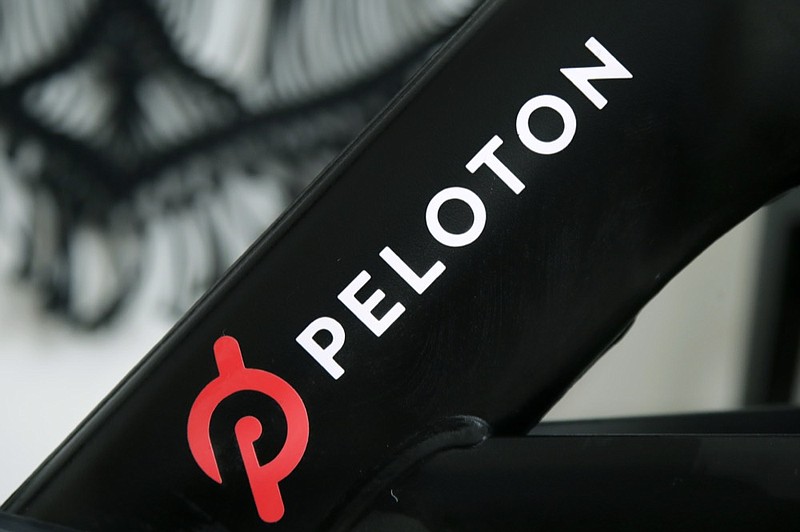 FILE - This Nov. 19, 2019 file photo shows a Peloton logo on the company's stationary bicycle in San Francisco. (AP Photo/Jeff Chiu, File)


