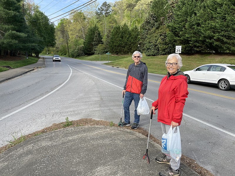 Rose and Rick Coddaire, retirees living in Red Bank, pick up trash daily along Mountain Creek Road. Motorists honk and wave in appreciation of the couple's work. Times Free Press Photo by Mark Kennedy