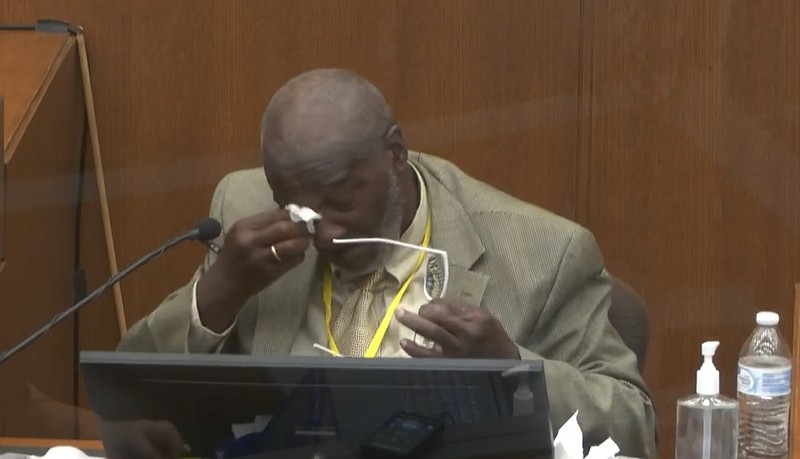 In this image from video, witness Charles McMillian becomes emotional as he answers questions as Hennepin County Judge Peter Cahill presides Wednesday, March 31, 2021, in the trial of former Minneapolis police Officer Derek Chauvin at the Hennepin County Courthouse in Minneapolis, Minn. Chauvin is charged in the May 25, 2020 death of George Floyd. (Court TV via AP, Pool)
