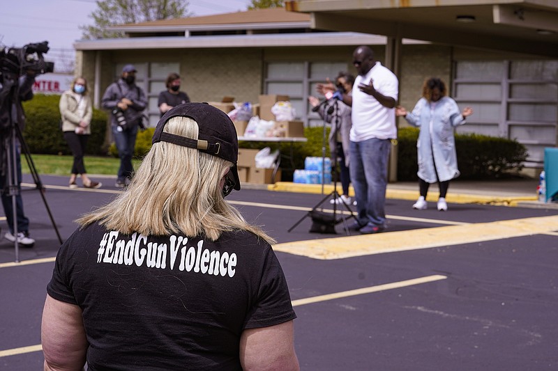 Photo by Michael Conroy of The Associated Press / A women wears a shirt calling for the end of gun violence during a vigil at the Olivet Missionary Baptist Church for the victims of the shooting at a FedEx facility in Indianapolis on Saturday, April 17, 2021. A gunman killed eight people and wounded several others before taking his own life in a late-night attack at a FedEx facility near the Indianapolis airport, police said.