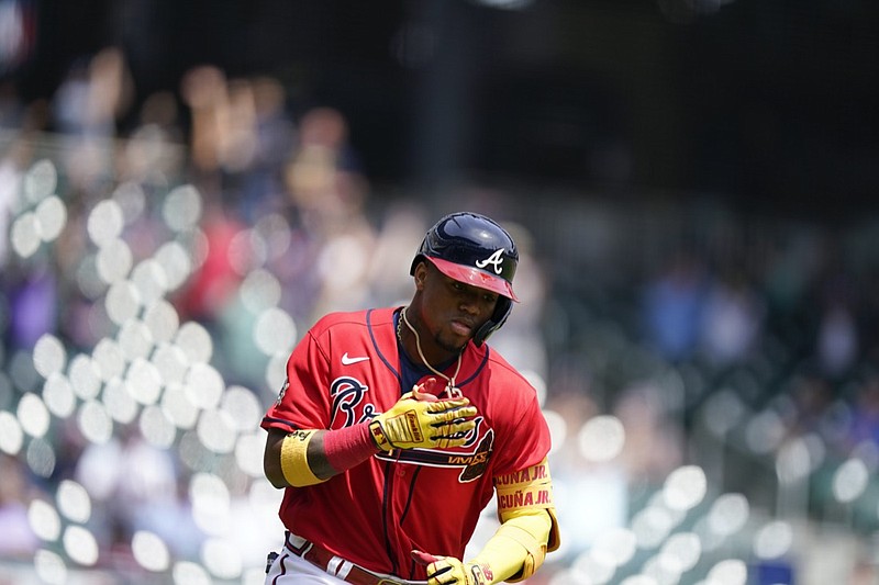 Atlanta Braves' Ronald Acuna Jr. (13) runs after hitting a home run in the fifth inning of a baseball game against the Miami Marlins, Thursday, April 15, 2021, in Atlanta. (AP Photo/Brynn Anderson)