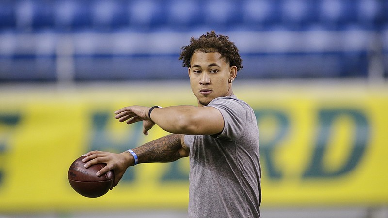 FILE - North Dakota State quarterback Trey Lance throws at the school's football NFL Pro Day in Fargo, N.D., in this Friday, March, 12, 2021, file photo. Lance will likely be one of the first two players drafted from non-Football Bowl Subdivision programs next week. (AP Photo/Andy Clayton-King, File)