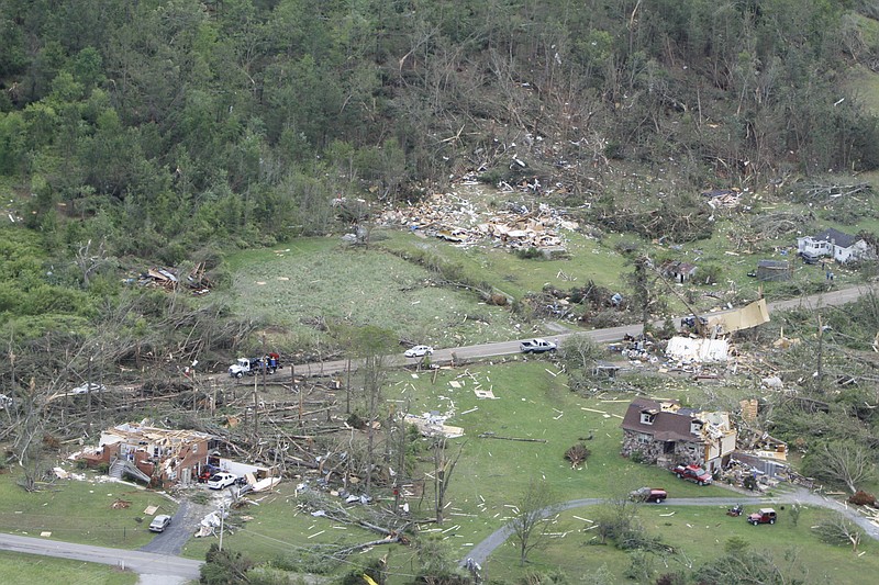 Staff File Photo / The remains of demolished Apison residences are scattered about after a tornado on April 27, 2011.